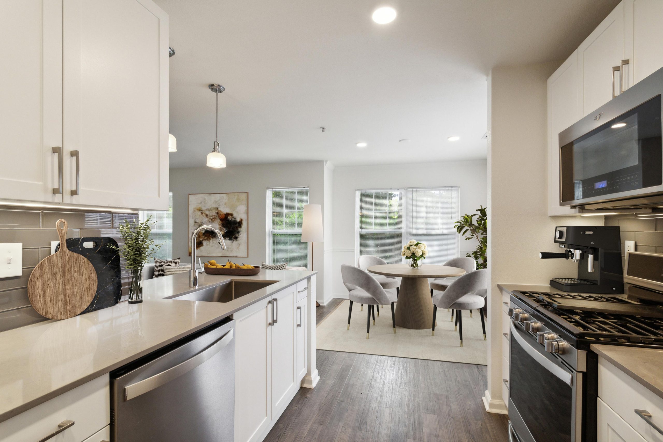 Kitchen with stainless steel appliances and dining room